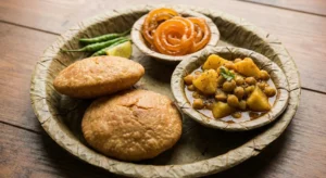 Hot Kachori Sabzi served on a leaf plate in a narrow lane of Banaras.
